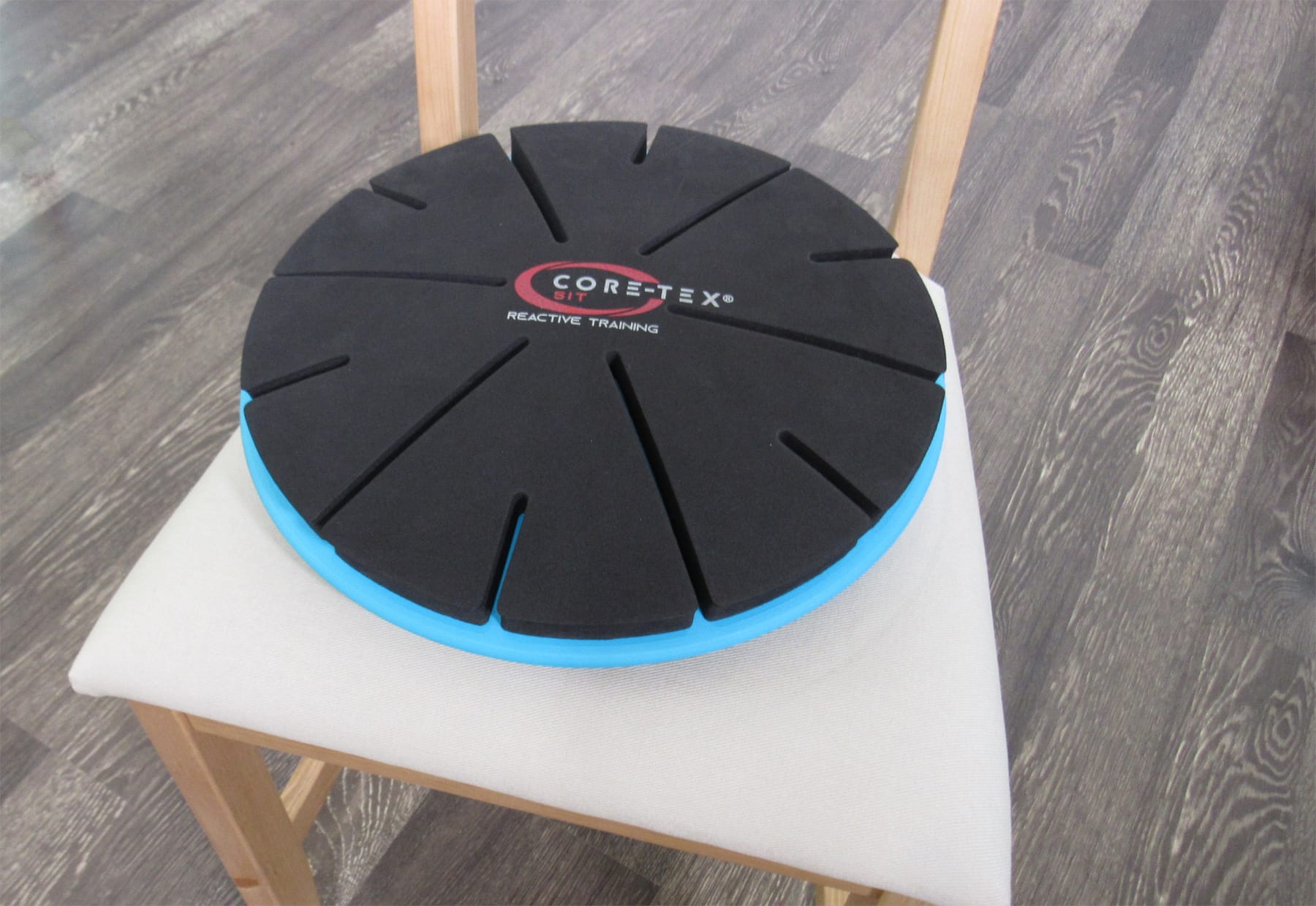 Core-Tex Sit product showcased on wooden chair with white cushion