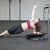 Woman performs oblique exercise on Core-Tex Reactive Trainer
