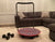Red Core-Tex Fitness Reactive Trainer in home living room next to dumbbells 