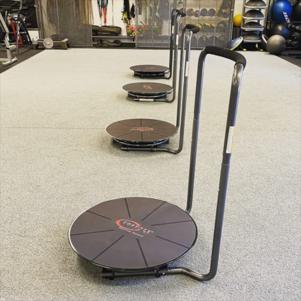 Four Core-Tex Reactive Trainers in a row on a gym studio floor.