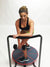 Woman working out on Core-Tex Reactive trainer with dumbbell